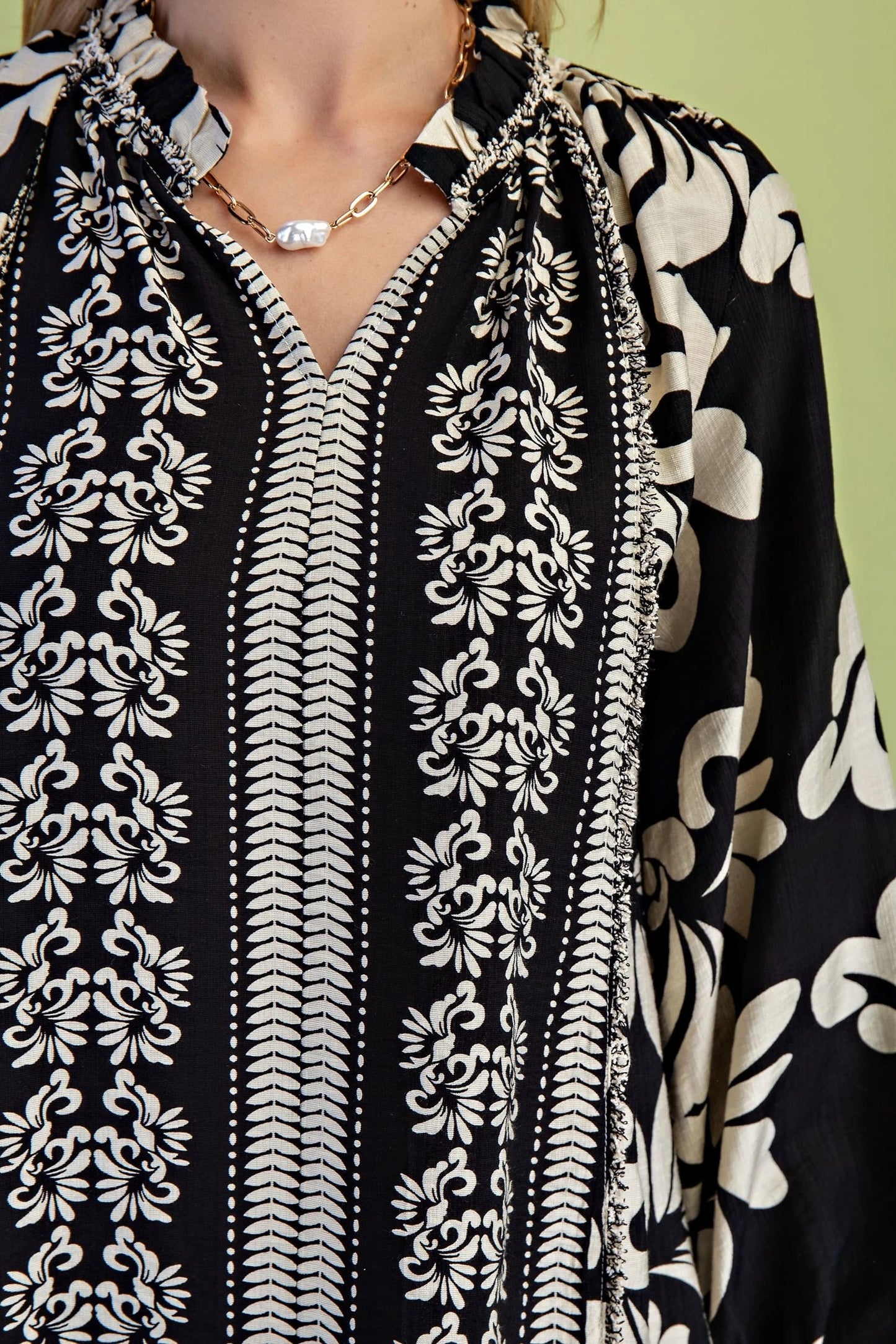 Gigio Printed Long Sleeve Blouse with a Ruffled Neck and Frayed Fringe Details